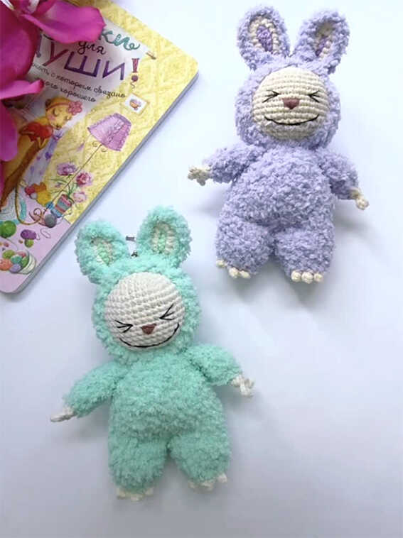 Two handmade bunny amigurumi toys in different colors showing design consistency and plush character style
