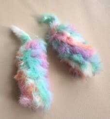 This frame shows the real crochet arms for the monster character as part of our free pattern tutorial. The pieces feature uniform stitches and a specific curved shape to match the project design. You can find the exact instructions for these parts in the linked guide.