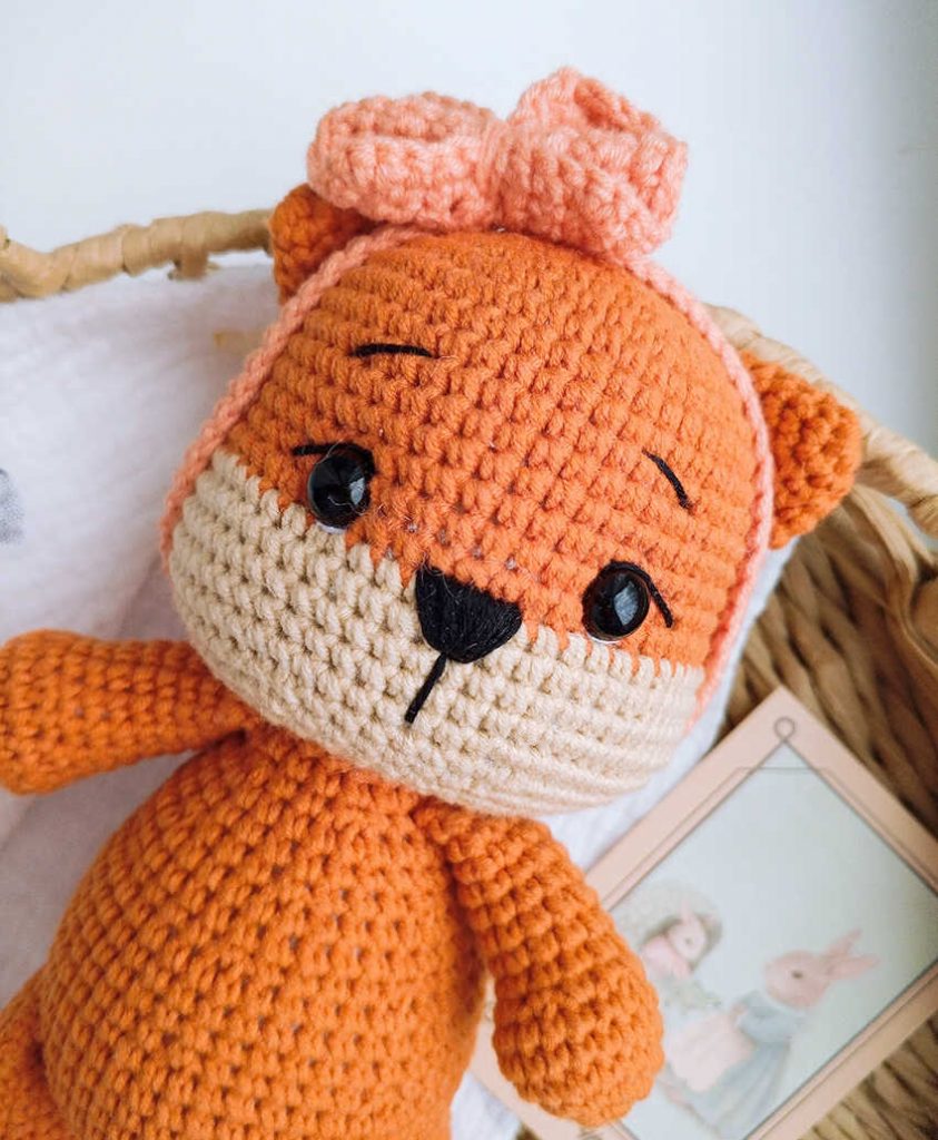 This is a high-quality image of the completed handmade fox plush toy from our free amigurumi pattern.