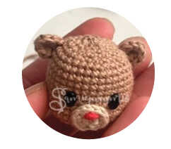 A detailed visualization focusing on the reindeer ear design, serving as an artistic preview of our free crochet pattern. This image captures the structural details to provide a stylistic reference for your handmade project. We share this concept to help you visualize the finished amigurumi reindeer face.